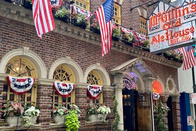 The exterior of McGillin's Olde Ale House in Center City, Philadelphia, Pa. sporting U.S. flags during the 2024 Olympic Games.